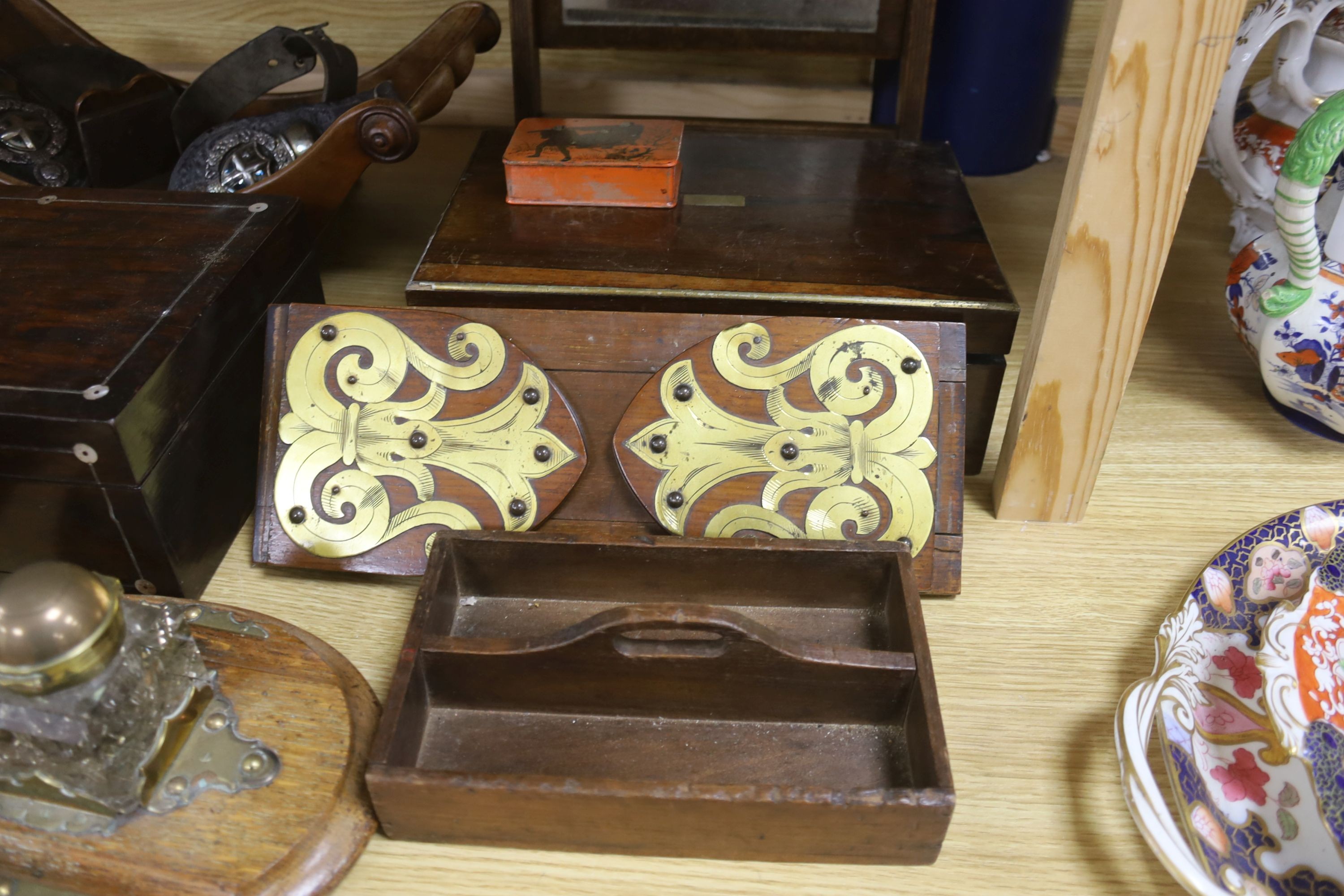 A Victorian mahogany cheese coaster, 40cm, an early 19th century toilet mirror, 29cm, an oak tea caddy, a book slide, an ink stand and sundry boxes